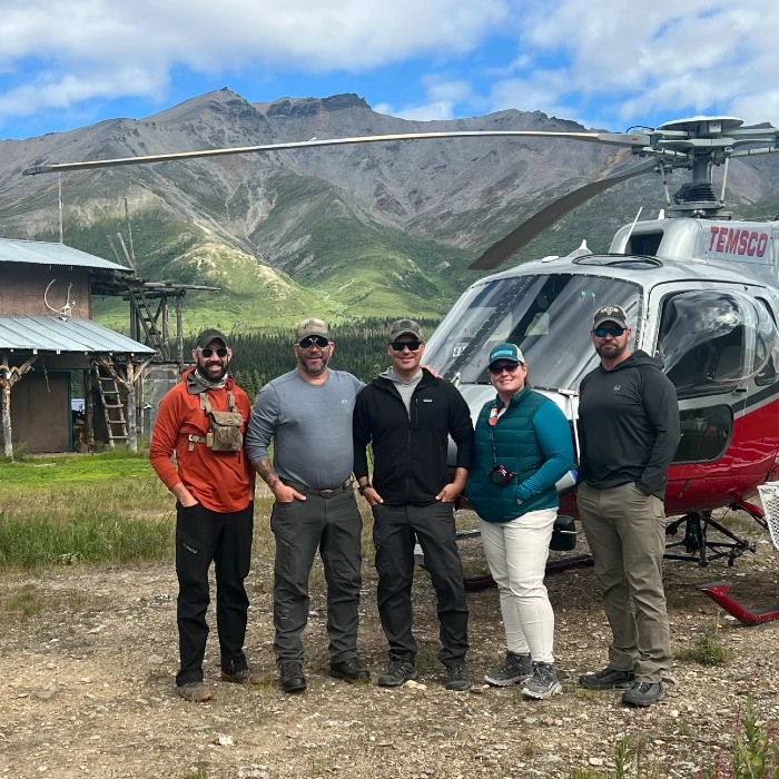 APEP group in front of helicopter